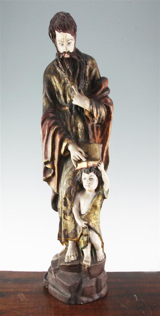 A 20th century carved and polychrome painted figure of a Saint, 31in.